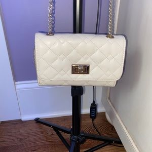 white and gold purse
